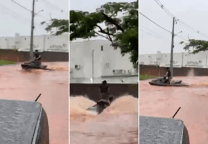 Morador de Araguaína usa moto aquática em ruas alagadas após forte chuva